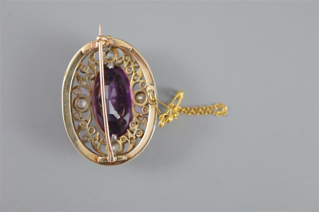 A Victorian gold and silver, diamond and amethyst set oval brooch, with safety chain,